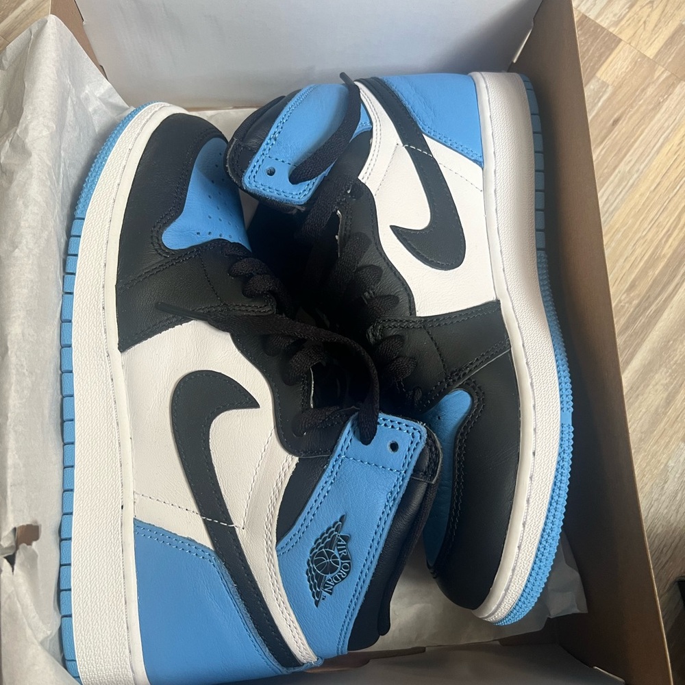 Nike Black and Blue Sneakers with Iconic Design